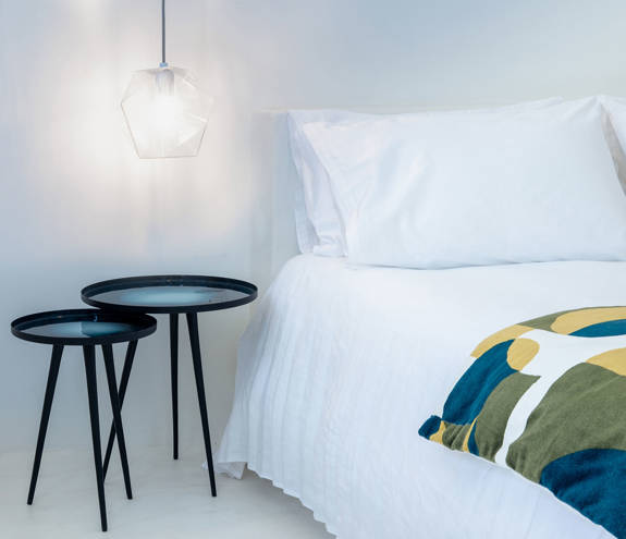 Koukoumi Vegan Hotel executive suite bed and amenities