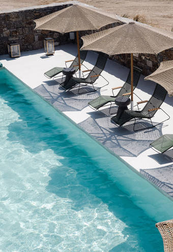 Koukoumi Vegan Hotel pool and sunbeds and umbrellas